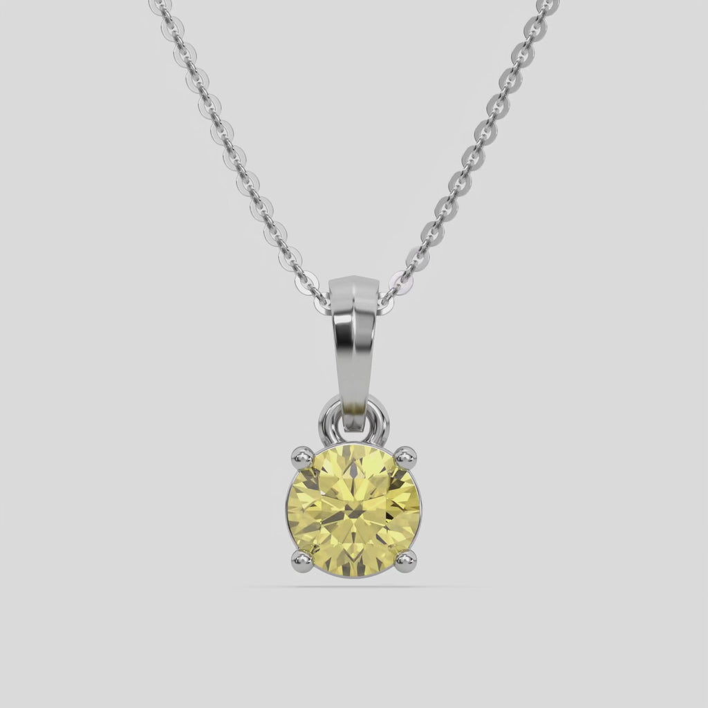 Fancy Yellow Round Solitaire Diamond Necklace made with fancy yellow round brilliant-cut diamond in a four prong setting with adjustable chain