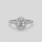 This video features a white gold ring is made with an oval solitaire diamond set in a four-prong setting