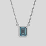 This yellow gold Fancy Blue Emerald Solitaire Diamond Necklace made with an fancy Blue emerald cut diamond in bezel setting with adjustable chain