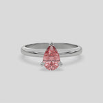 This video features a white gold ring features a fancy Pink pear solitaire diamond elegantly secured in a three-prong setting on a solid gold band