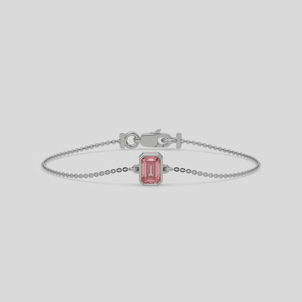 Fancy Pink Solitaire Emerald Diamond Bracelet made with fancy Pink emerald brilliant-cut diamond, securely set in bezel setting