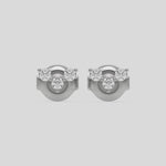 This video features a white gold Trio Diamond Earrings made using three round brilliant-cut diamonds creating a v shaped design, securely set in prong setting