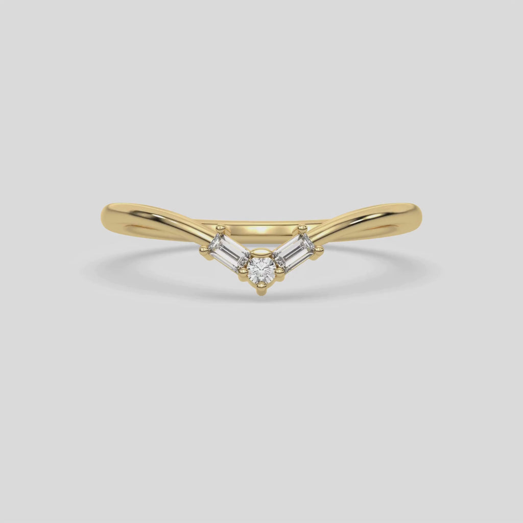 This video features a yellow gold Chevron Diamond Ring handmade with round brilliant-cut diamonds and baguette diamonds all set in a shared prong setting