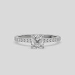 This ring is made with a cushion diamond set in four-prong setting, and is complemented by a round pave diamonds band.