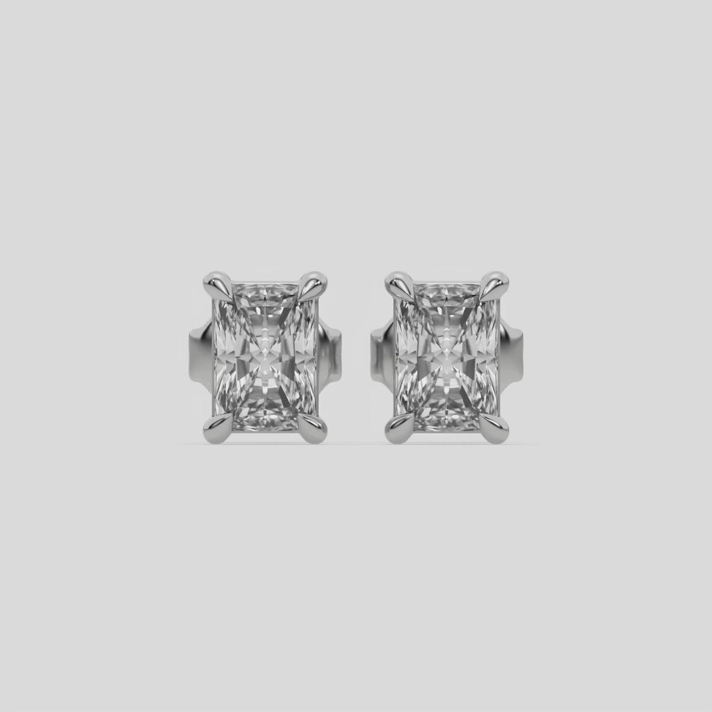 This video features a white gold Classic Radiant Diamond Earrings made with a radiant-cut diamonds set in a four prong setting