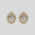 This video features a yellow gold Classic Pear Diamond Halo Earrings made with a pear-cut solitaire diamonds set in a four prong setting