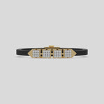 This video features a yellow gold  axel diamond rubber bracelet features two box motifs in the center and two box motifs with arrows on each end. The bracelet elegantly showcases 36 diamonds set in a four-prong setting