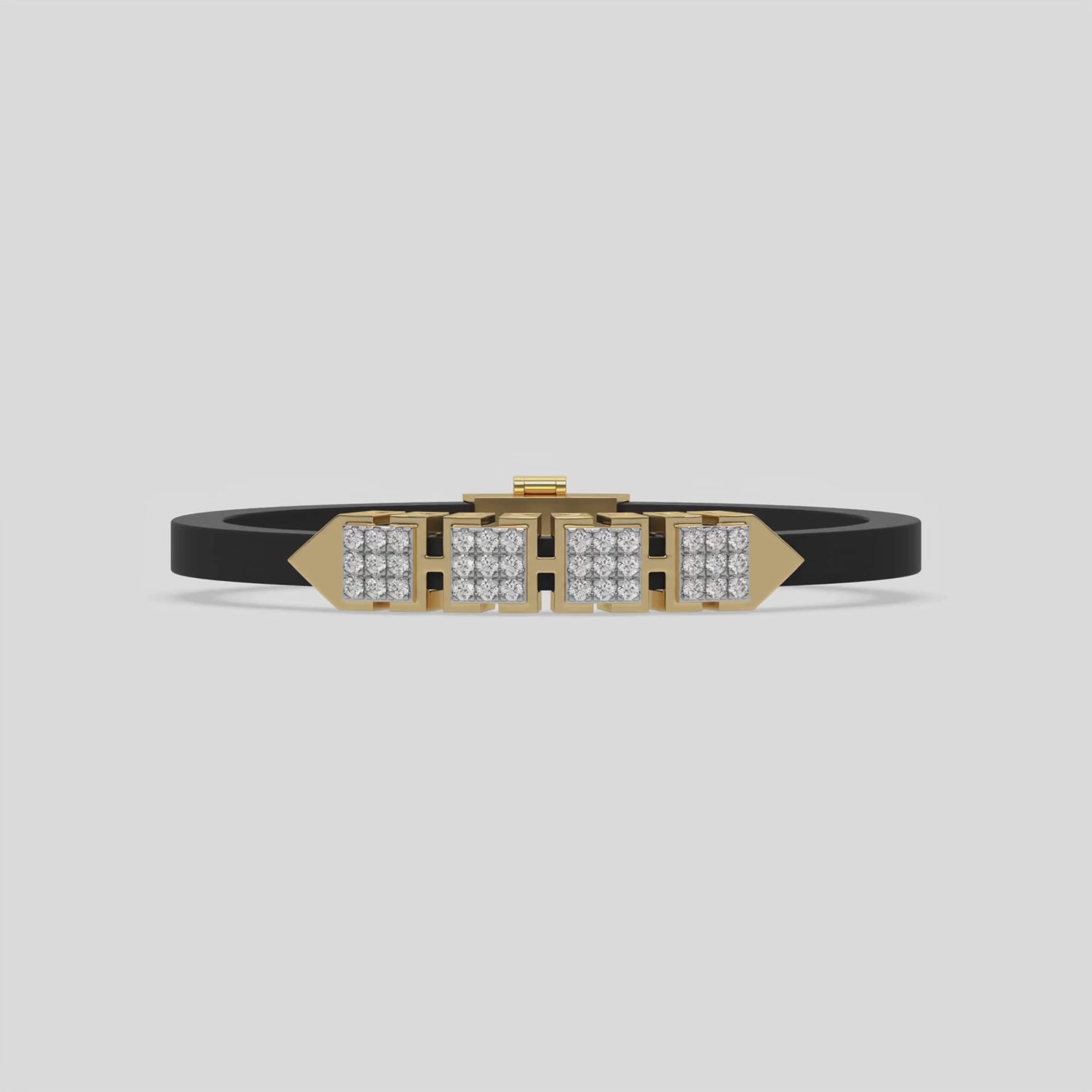 This video features a yellow gold  axel diamond rubber bracelet features two box motifs in the center and two box motifs with arrows on each end. The bracelet elegantly showcases 36 diamonds set in a four-prong setting