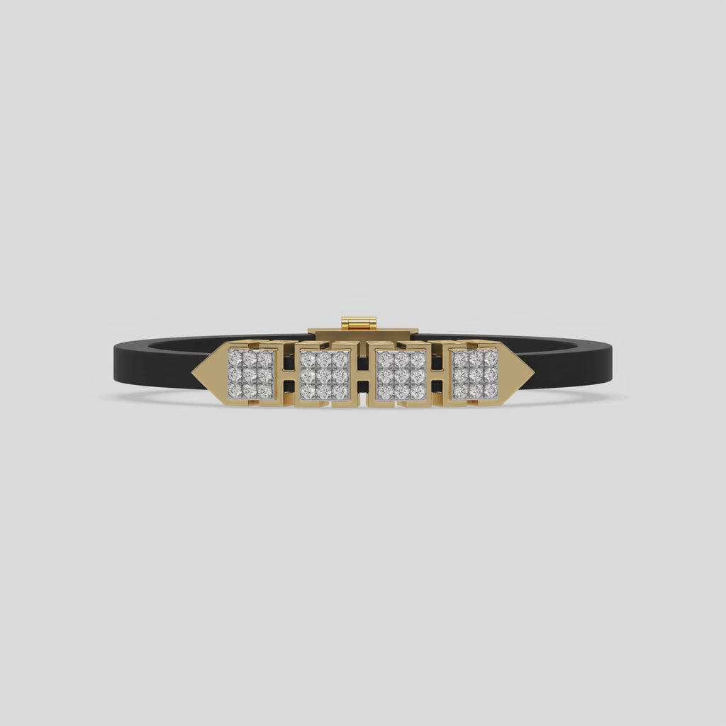 This video features a yellow gold  axel diamond rubber bracelet features two box motifs in the center and two box motifs with arrows on each end. The bracelet elegantly showcases 36 diamonds set in a four-prong setting