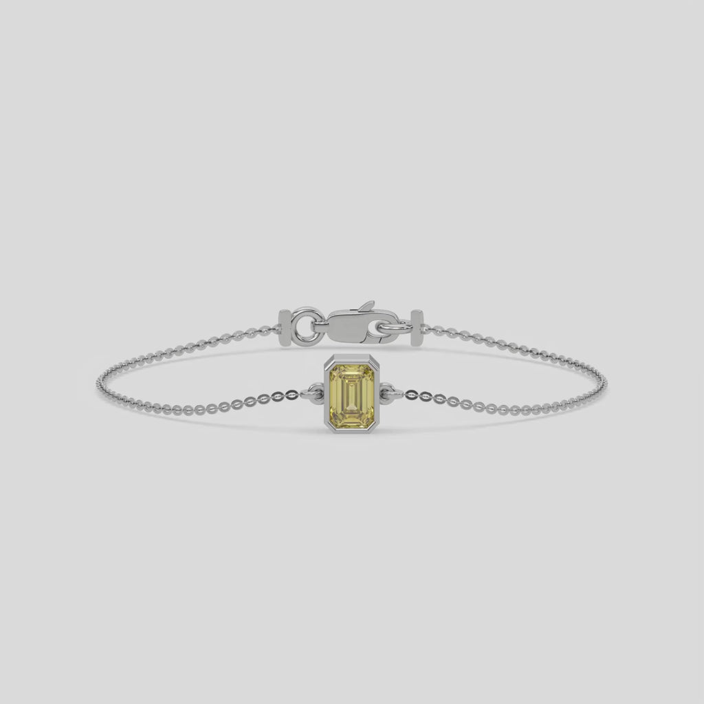 Fancy Yellow Solitaire Emerald Diamond Bracelet made with fancy yellow emerald brilliant-cut diamond, securely set in bezel setting