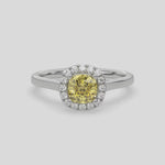 This video features a white gold ring features a fancy Yellow cushion solitaire diamond set in a four-prong setting