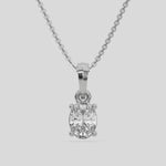  Oval Solitaire Diamond Necklace made with an oval cut diamond in a four prong setting with adjustable chain 