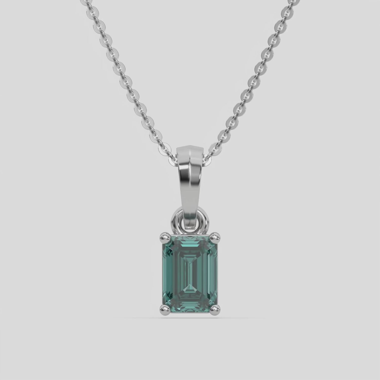 This white gold Fancy Green Emerald Solitaire Diamond Necklace made with an fancy Green emerald cut diamond in a four prong setting with adjustable chain