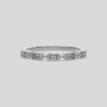 This video features a white gold 5 Baguette Diamond Ring handmade with five baguette diamonds and arranged in a horizontal orientation, while each diamond is set individually in a bezel setting