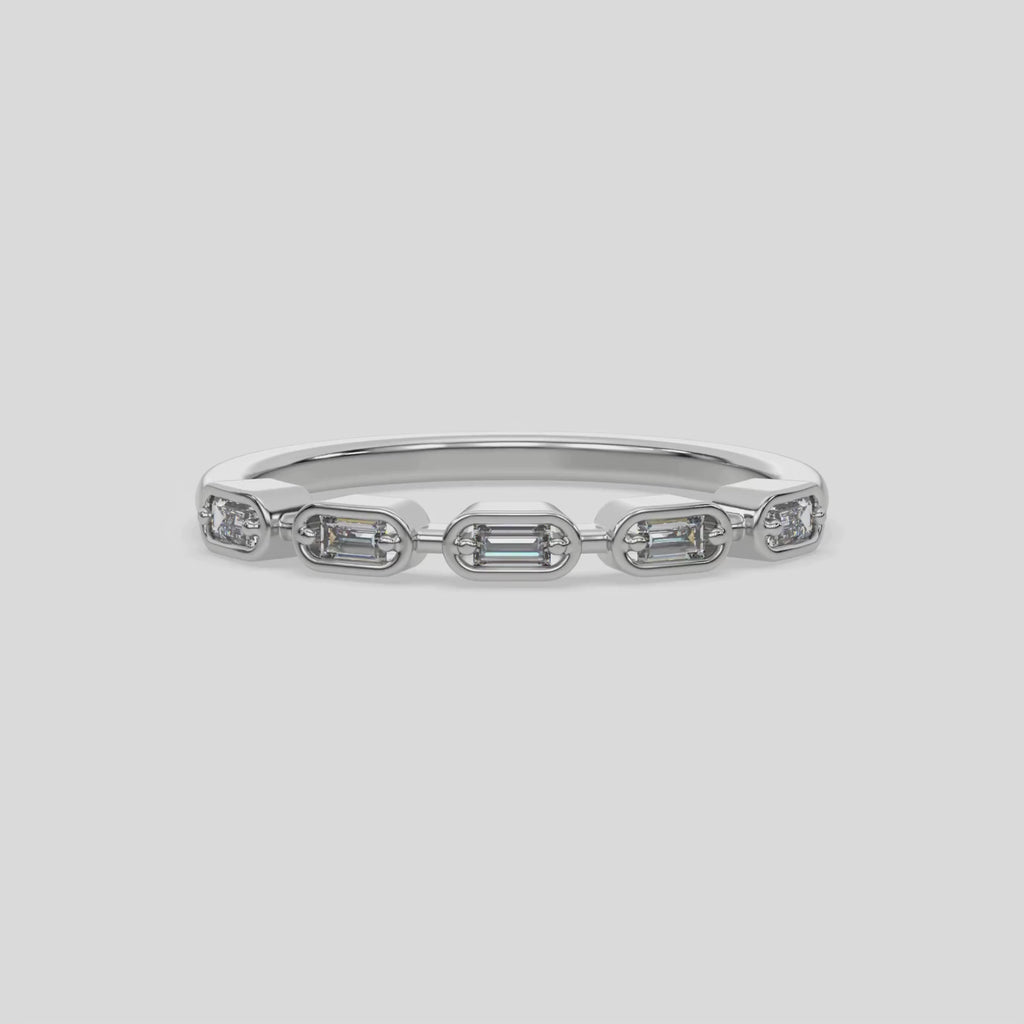 This video features a white gold 5 Baguette Diamond Ring handmade with five baguette diamonds and arranged in a horizontal orientation, while each diamond is set individually in a bezel setting