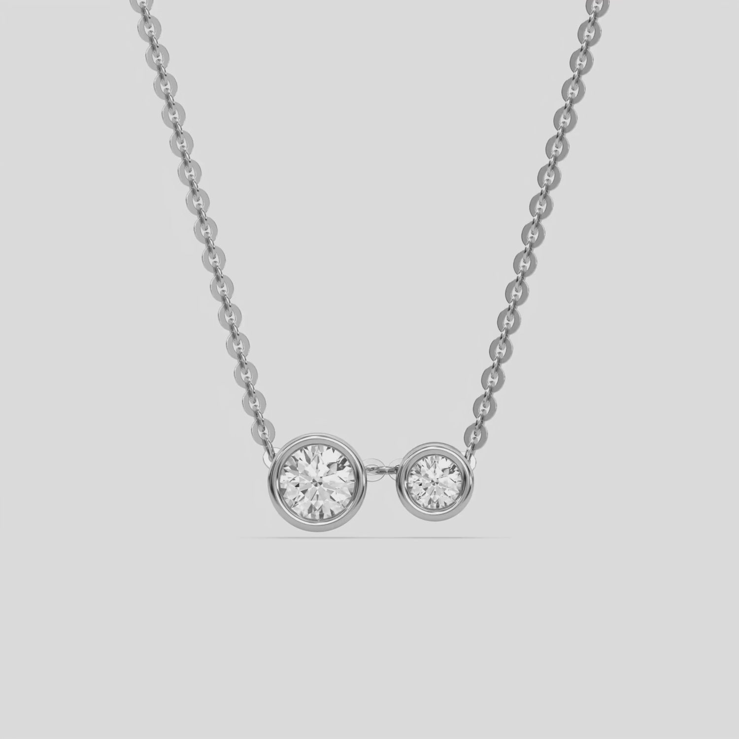 This yellow gold Round Diamond Necklace made with two round brilliant-cut diamonds, securely set in bezel setting