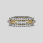 This dual-tone diamond eternity ring, featuring approximately 1.55 carats of round brilliant-cut diamonds meticulously set in a combination of prong and flush settings