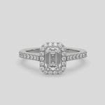 This video features a white gold Emerald Diamond Halo Engagement Ring is made with an emerald solitaire diamond set in a four-prong setting 