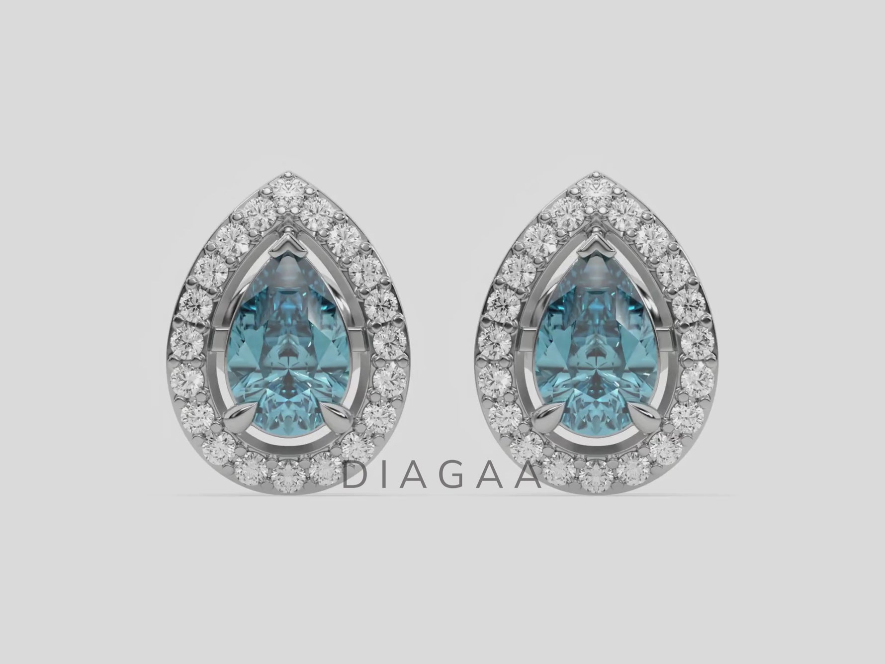 18k white gold Pear Diamond Halo Earrings made with a fancy Blue pear cut solitaire diamonds set in a four prong setting.