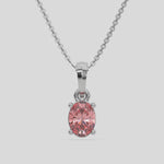 This white gold Fancy Pink Oval Solitaire Diamond Necklace made with an fancy Pink oval cut diamond in a four prong setting with adjustable chain 