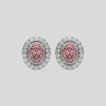 This video features a white gold Classic Oval Diamond Halo Earrings made with an fancy pink oval cut solitaire diamonds set in a four prong setting