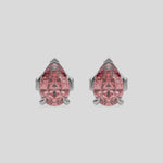 This video features a white gold Classic Pear Diamond Earrings made with a fancy pink pear-cut diamonds set in a four prong setting