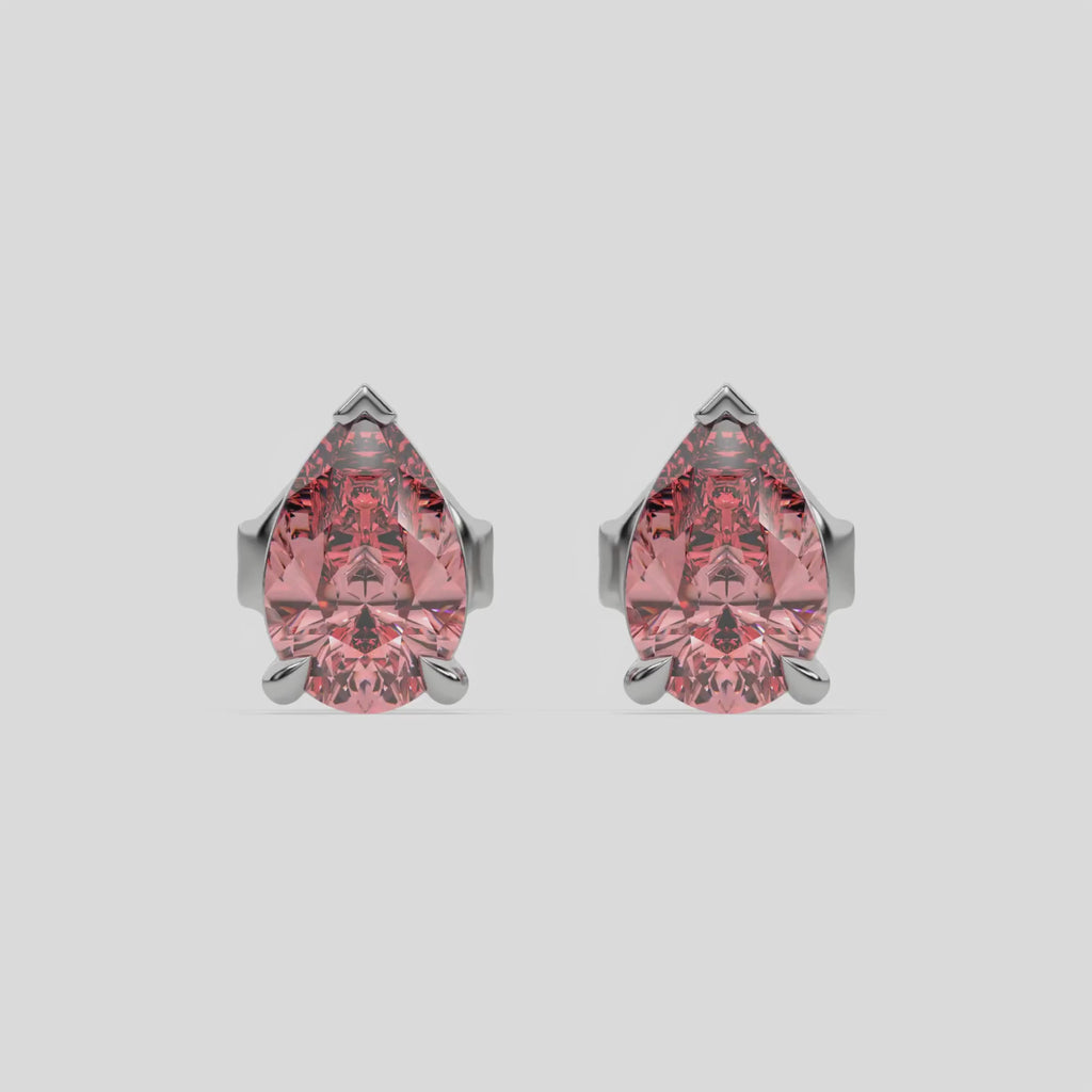 This video features a white gold Classic Pear Diamond Earrings made with a fancy pink pear-cut diamonds set in a four prong setting