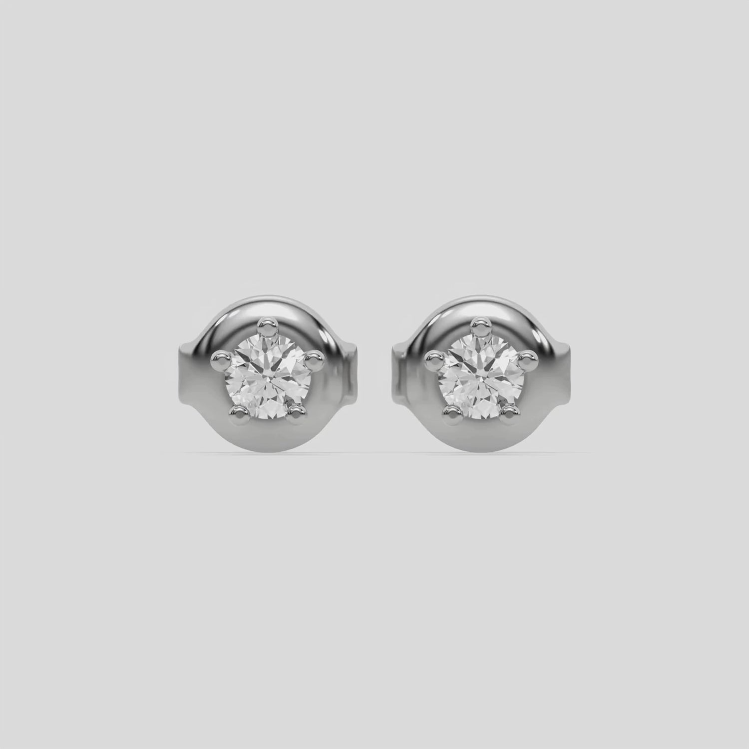 This video features a white gold Classic Round Solitaire Diamond Earrings made with round brilliant-cut diamond and set in a five prong setting