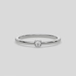 This video features a Thin white gold band with a round solitaire diamond in bezel setting