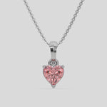 This white gold Fancy Pink Heart Solitaire Diamond Necklace made with a fancy Pink heart cut diamond in a four prong setting with adjustable chain 