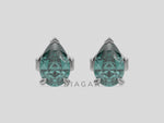 18k white gold Pear shaped diamond Earrings made with a fancy green pear shaped diamond set in a four prong setting