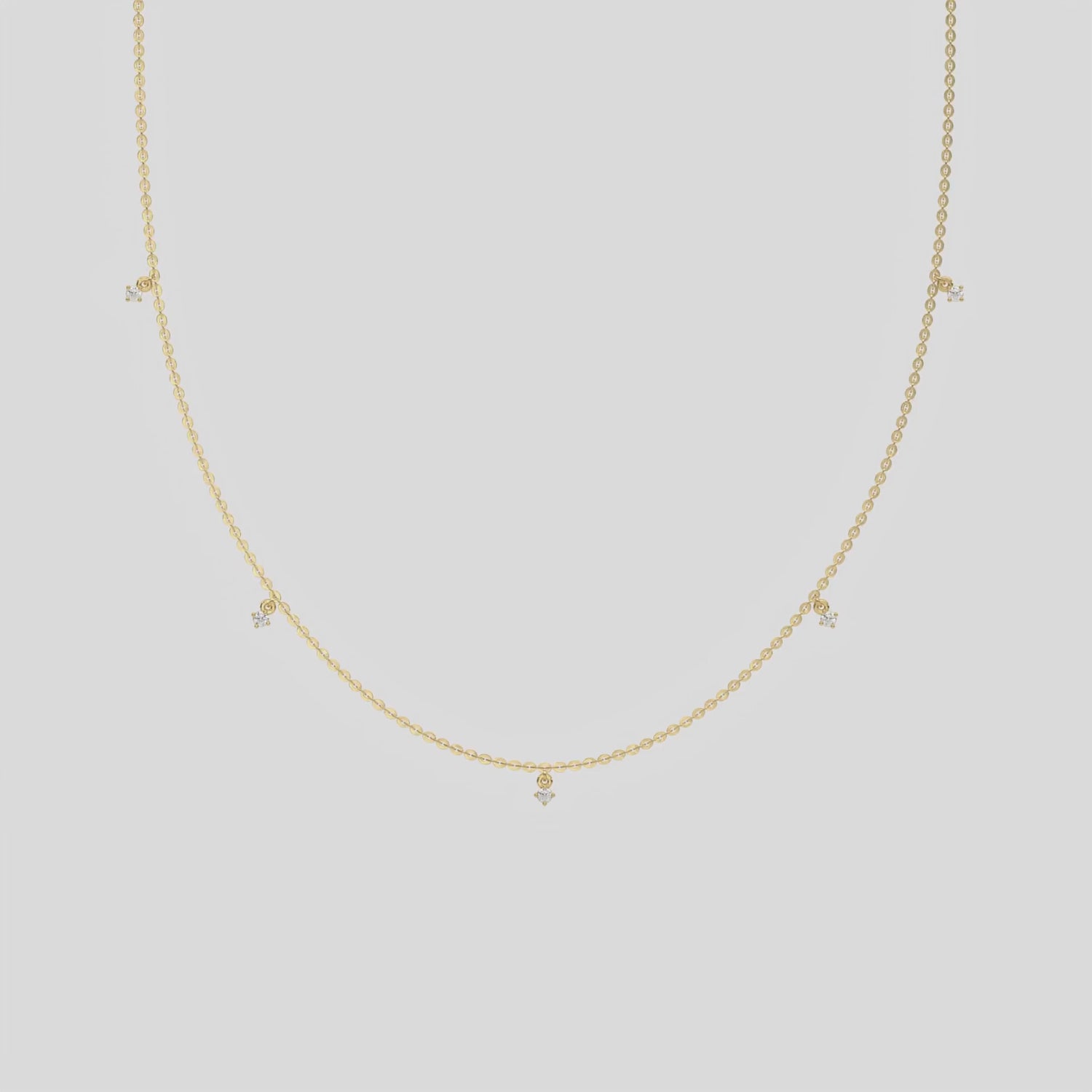 This yellow gold Round Dangling Diamond Necklace made with five round brilliant-cut diamond set in a prong setting, distributed evenly along the chain 