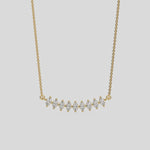 Curved Bar Diamond Necklace made with nine oval cut diamond set in a two prong setting