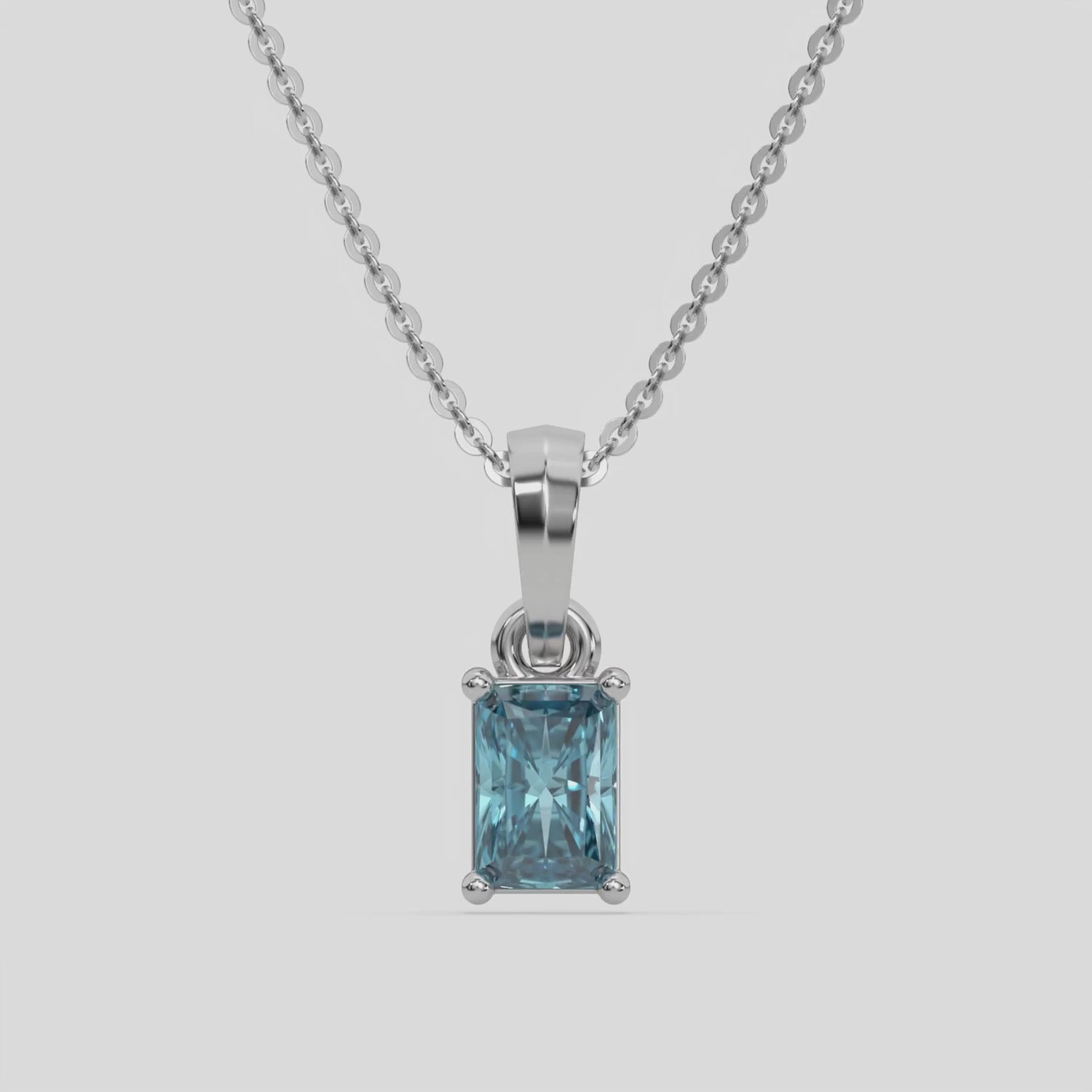 Fancy Blue Radiant Solitaire Diamond Necklace made with fancy radiant cut diamond in a four prong setting with adjustable chain