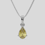 This white gold Fancy Yellow Pear Solitaire Diamond Necklace made with a fancy yellow pear cut diamond in a four prong setting with adjustable chain 