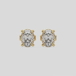 This video features a yellow gold Classic Oval Diamond Earrings made with an oval-cut diamonds set in a four prong setting