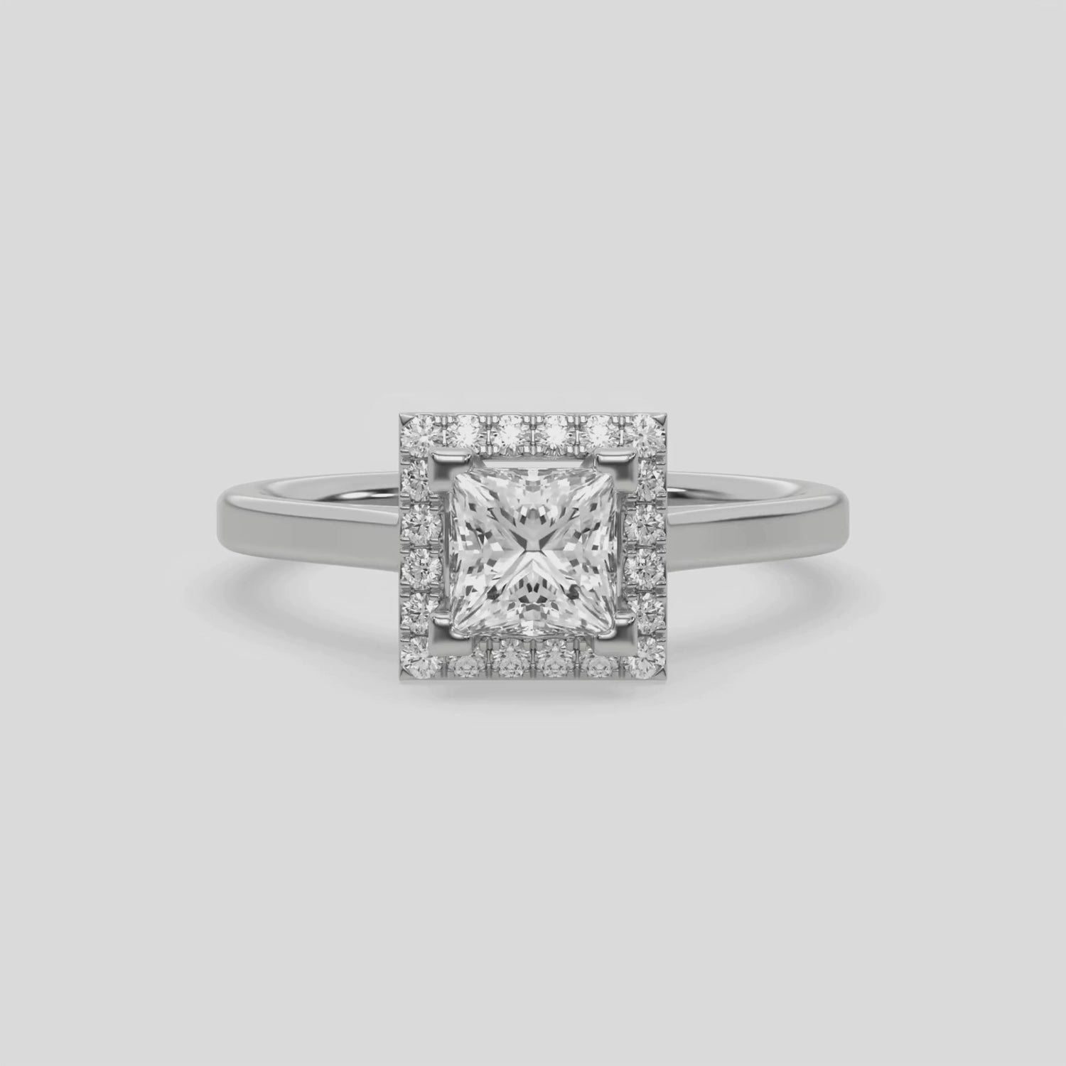 This video features a white gold ring is made with a princess solitaire diamond set in a four-prong setting