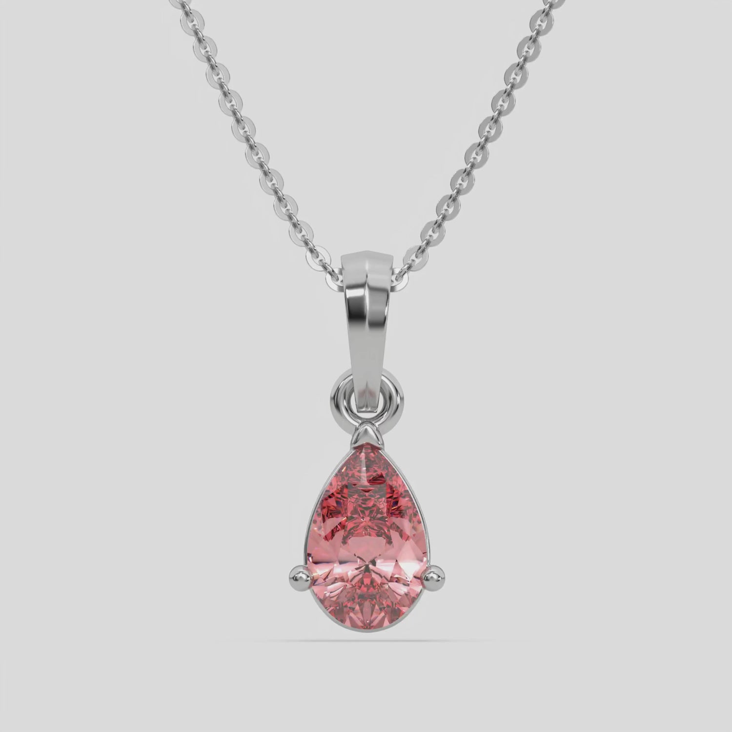 This white gold Fancy Pink Pear Solitaire Diamond Necklace made with a fancy Pink pear cut diamond in a four prong setting with adjustable chain