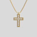 This yellow gold Cross Diamond Necklace made with round brilliant-cut diamonds, securely set in prong setting