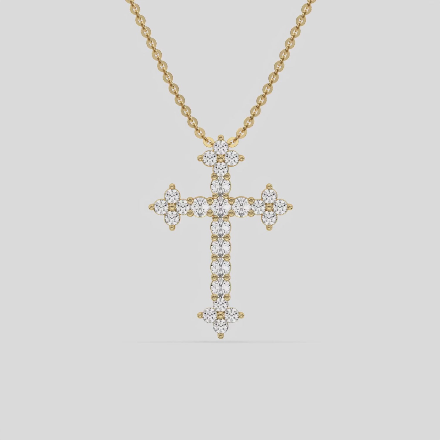 This yellow gold Cross Diamond Necklace made with round brilliant-cut diamonds, securely set in shared prong setting