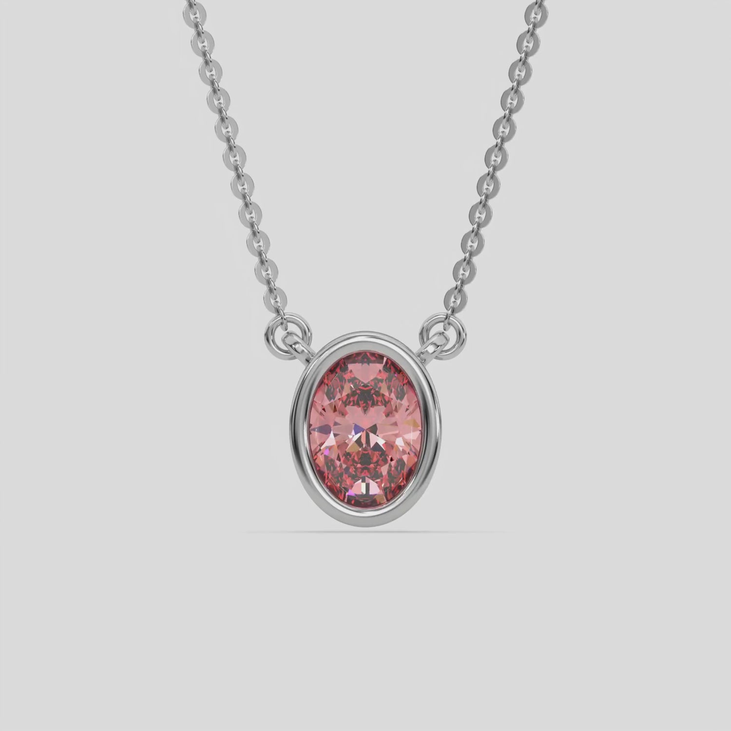 This white gold Fancy Pink Oval Solitaire Diamond Necklace made with an fancy Pink oval cut diamond in bezel setting with adjustable chain 