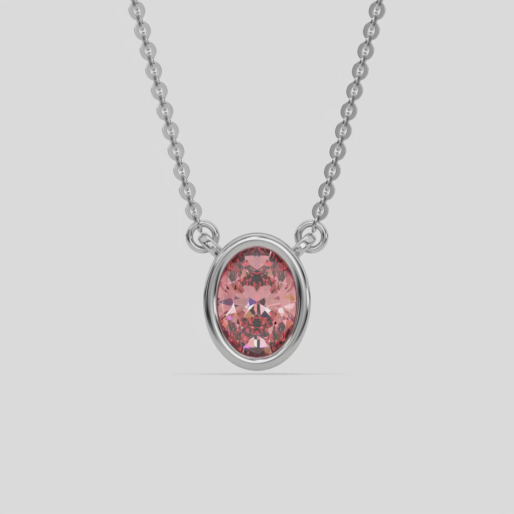 This white gold Fancy Pink Oval Solitaire Diamond Necklace made with an fancy Pink oval cut diamond in bezel setting with adjustable chain 