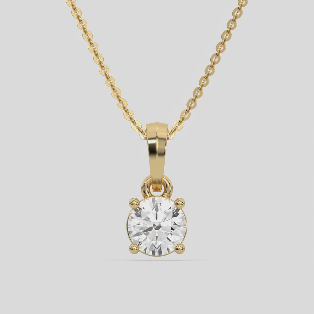 Round Solitaire Diamond Necklace made with round brilliant-cut diamond in a four prong setting with adjustable chain