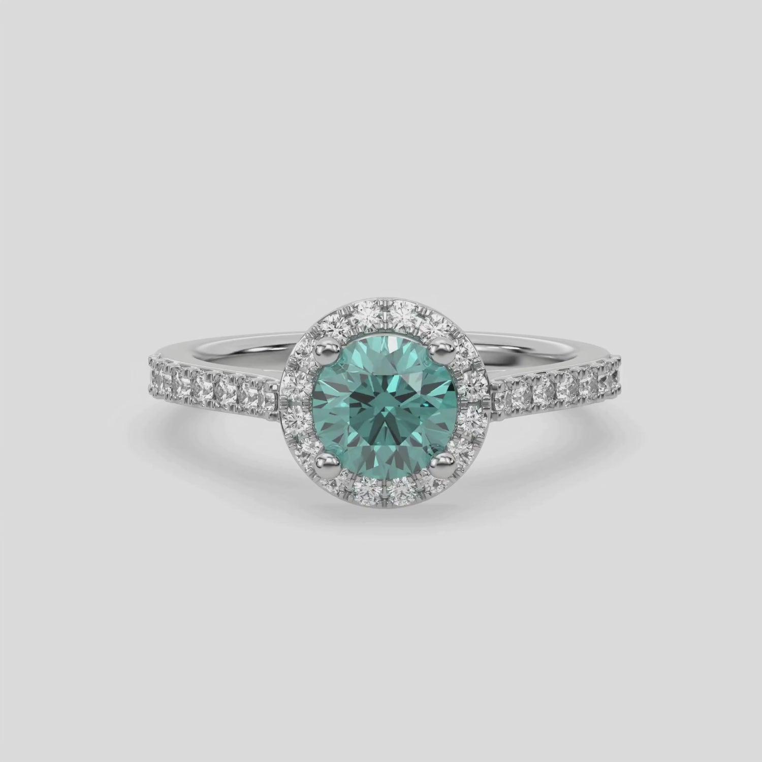 This video features a white gold Round Diamond Halo Engagement Ring is made with a fancy Green round solitaire diamond set in a four-prong setting