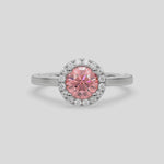 This video features a white gold ring features a fancy Pink round solitaire diamond set in a four-prong setting