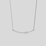 Curved Bar Diamond Necklace made with round brilliant-cut diamond in prong setting with a round solitaire on top set at an angle with adjustable chain