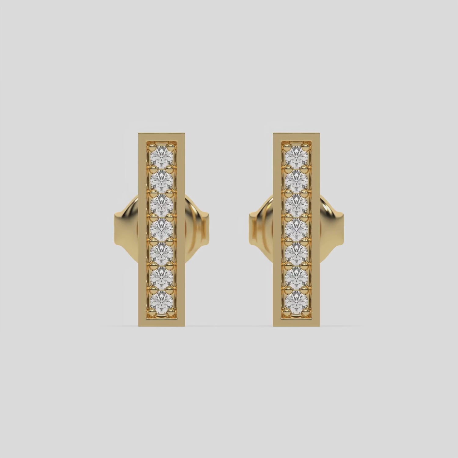 This video features a yellow gold Bar Diamond Stud Earring made with round brilliant-cut diamond and set in pave setting