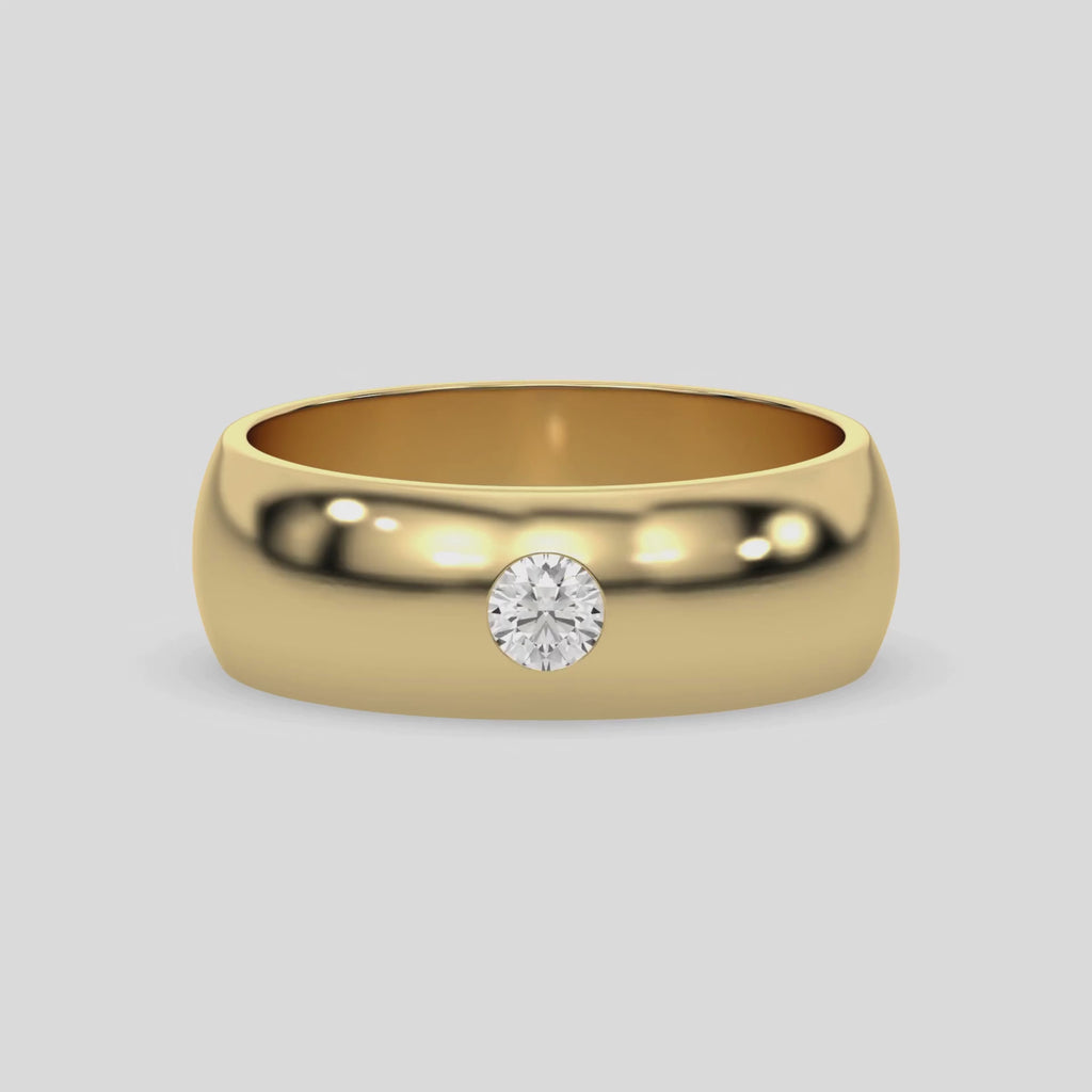 This video features a yellow gold classic flush-set diamond wedding ring, featuring a single round brilliant-cut diamond delicately set in a flush setting 