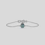 Fancy Green Solitaire Pear Diamond Bracelet made with fancy Green Pear-cut diamond, securely set in bezel setting