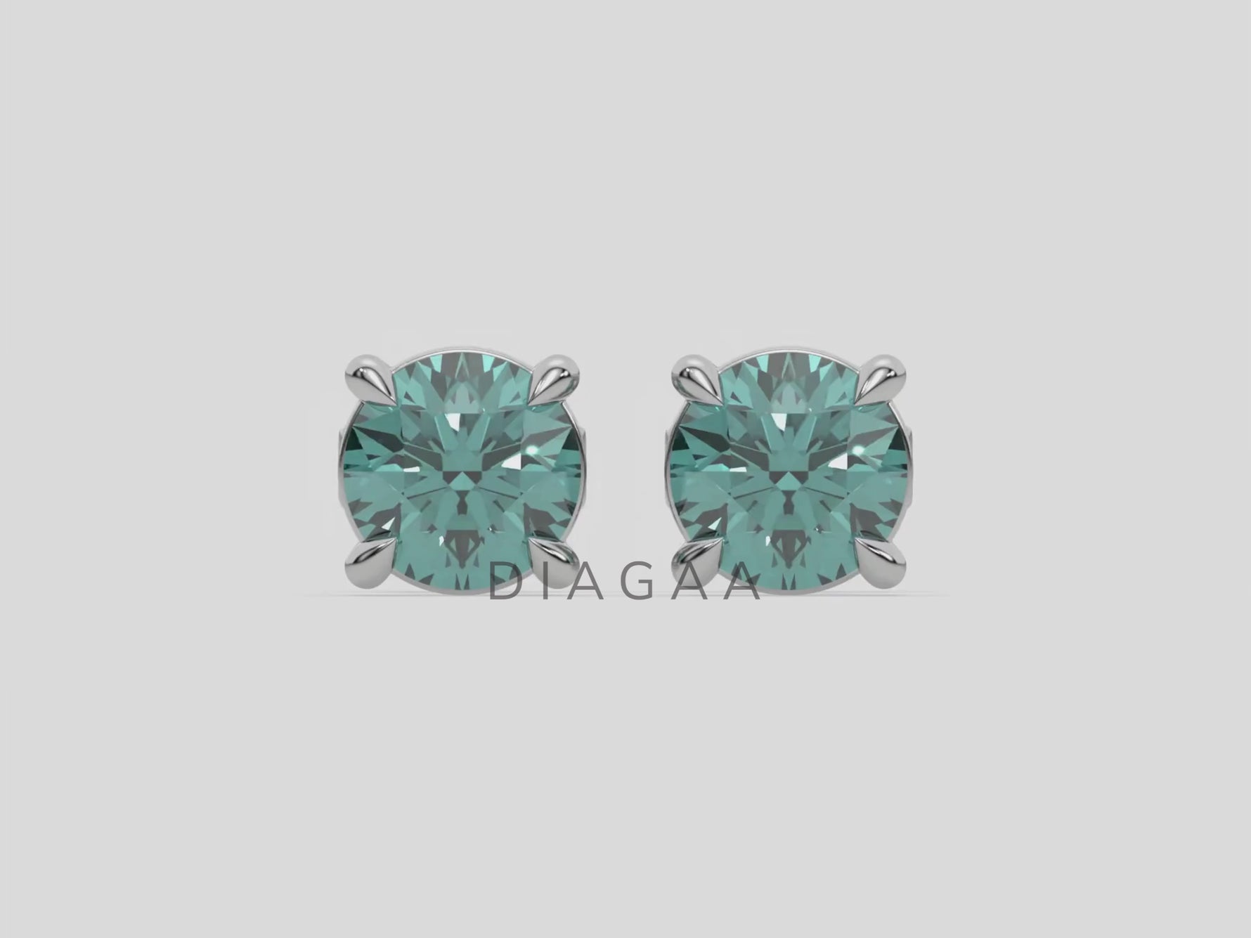 18k white gold Round Diamond Studs made with fancy green round brilliant-cut diamonds set in a four prong setting
